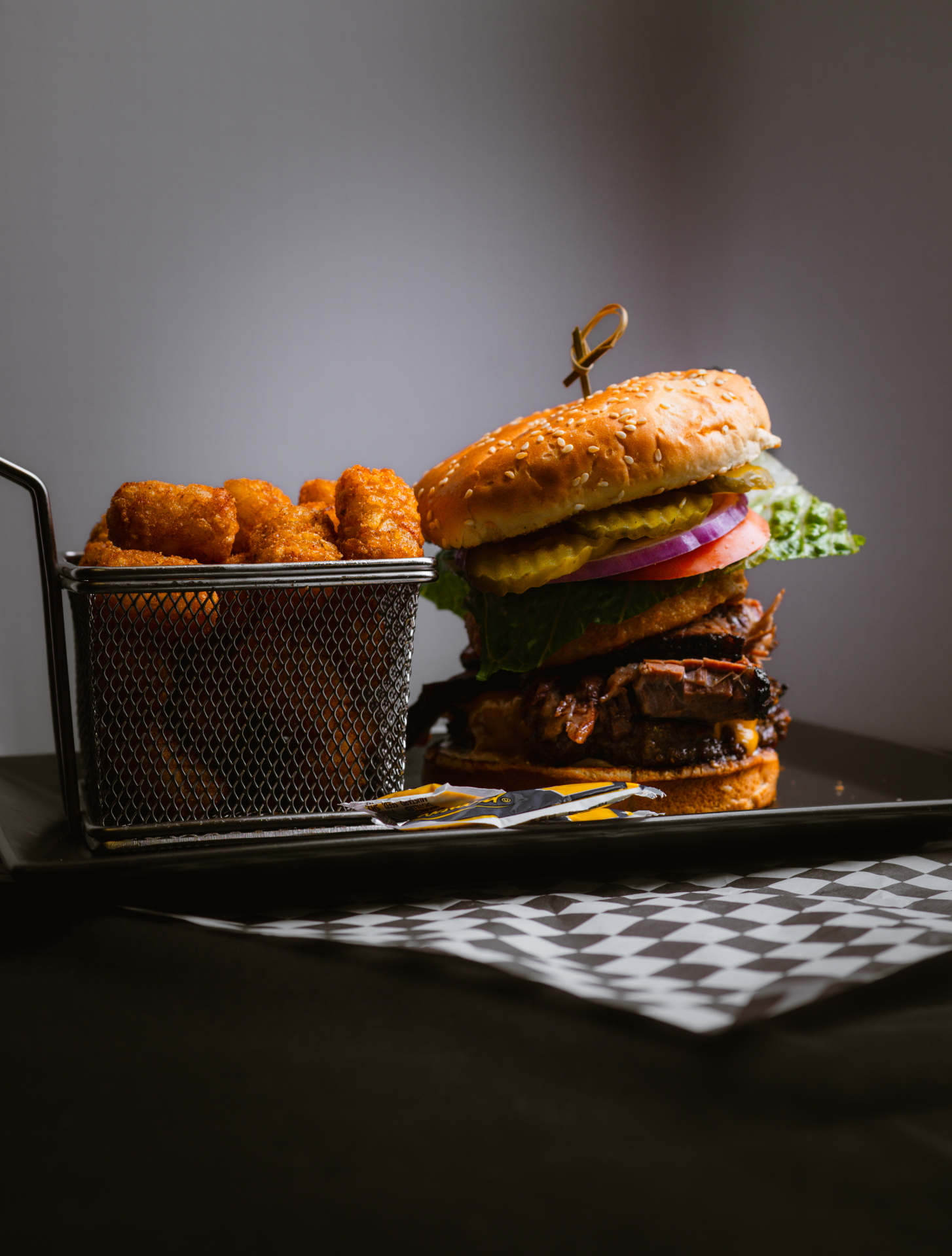 Stacked BBQ burger with tater tots