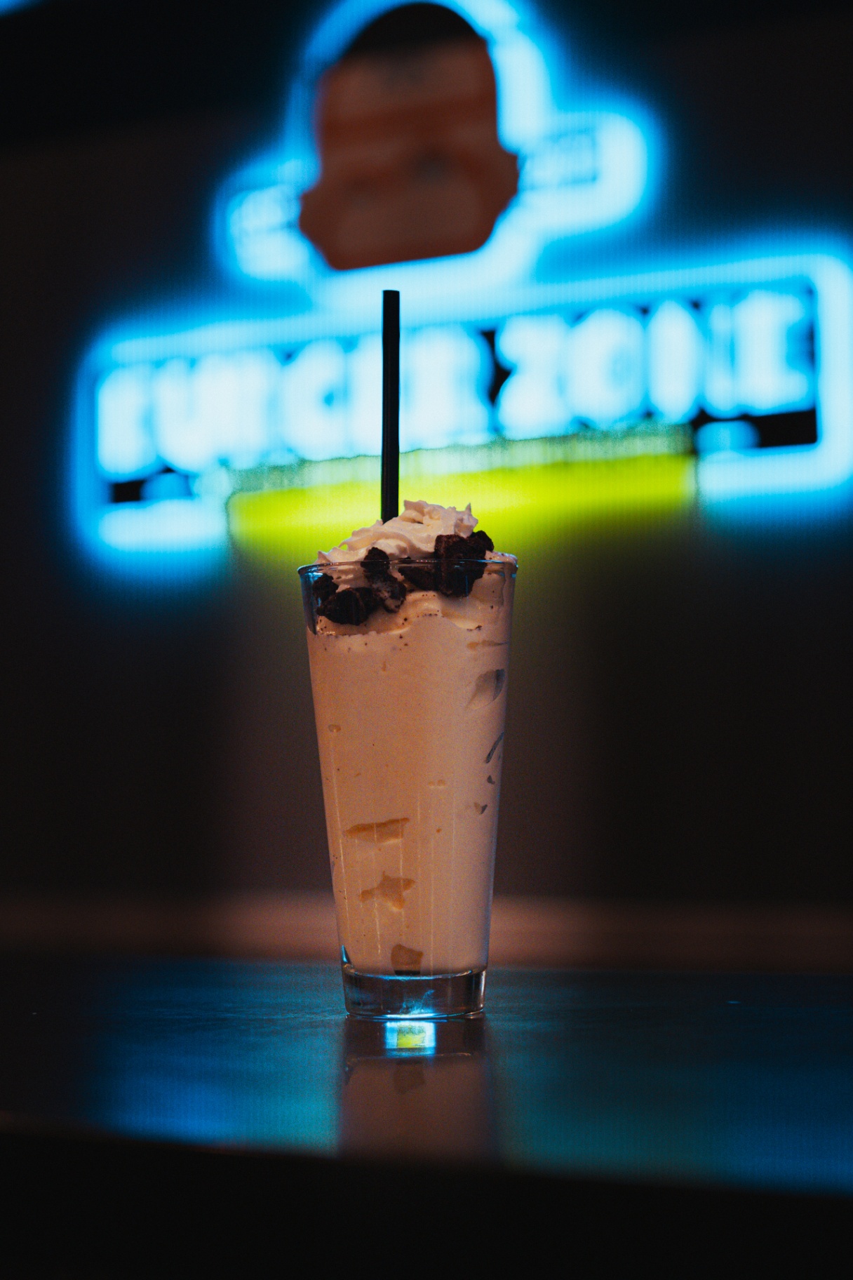 Cookies and cream milkshake with neon sign